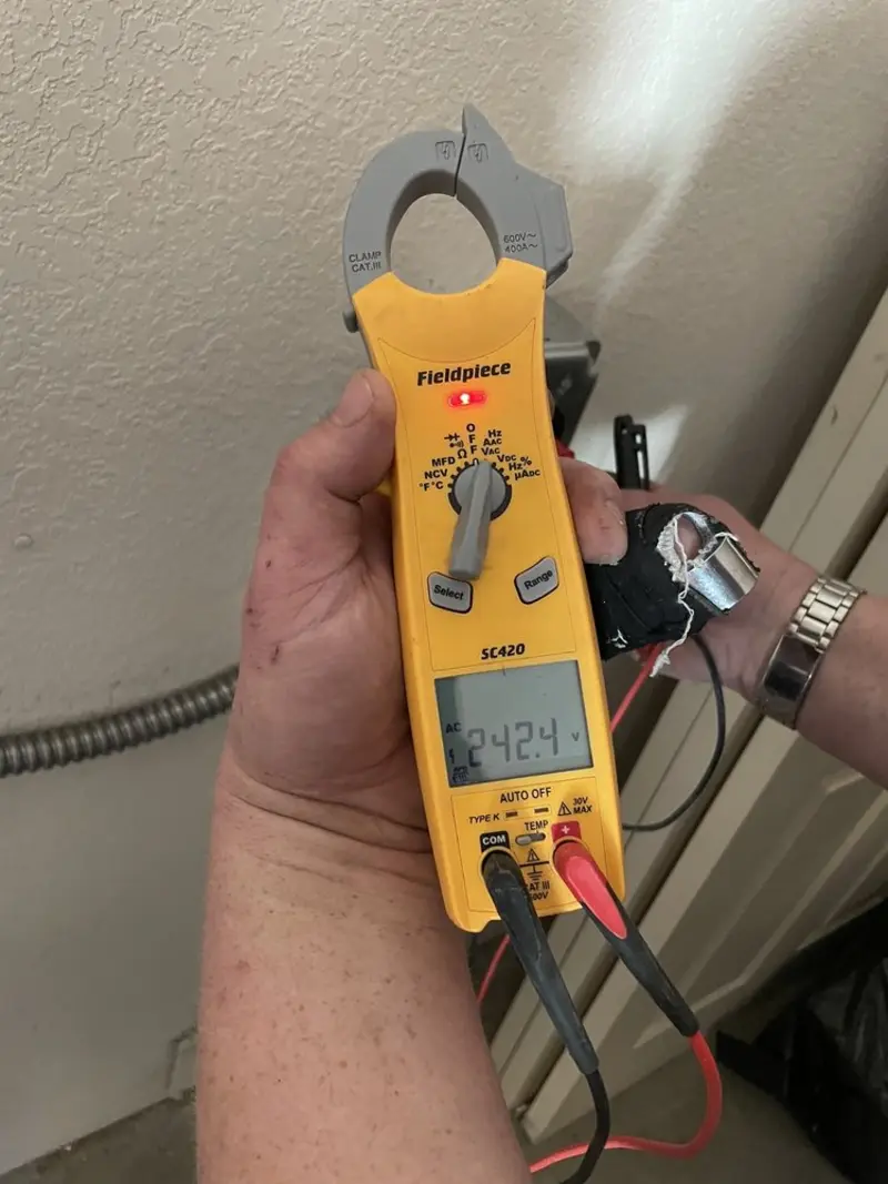 Voltage testing with clamp meter during Generator Installation in Freedom